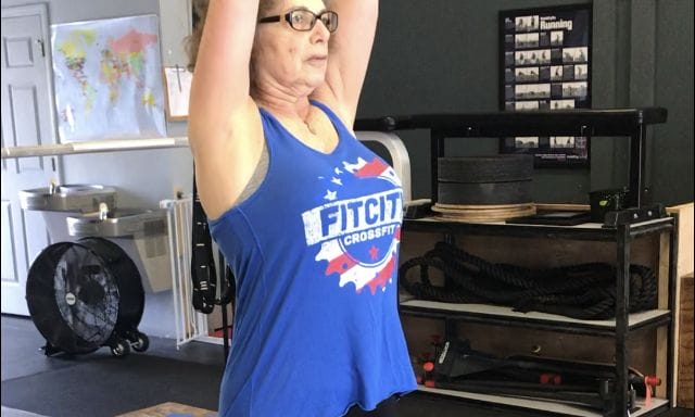 mom senior citizen weightlifting cropped